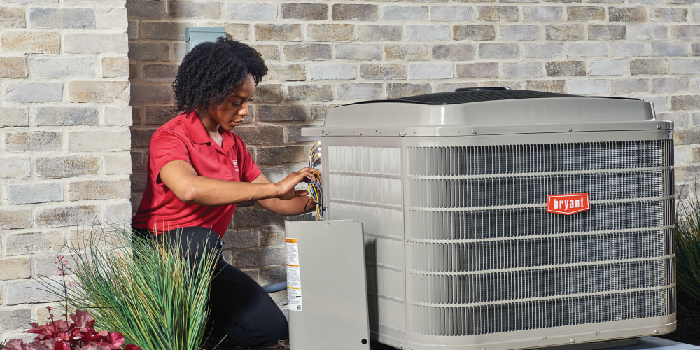 Bryant technician installing a new air conditioner